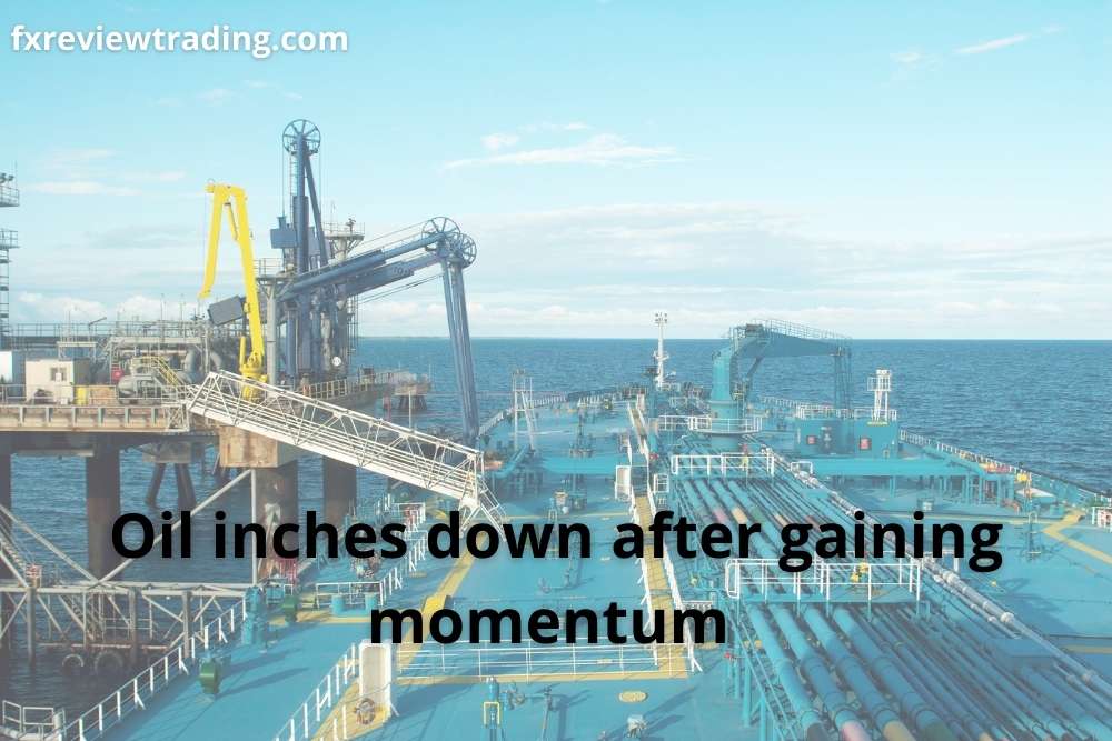Oil inches down after gaining momentum